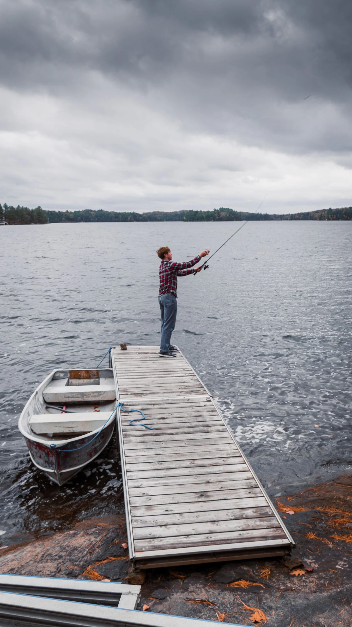 Angler fishing from a wooden dock