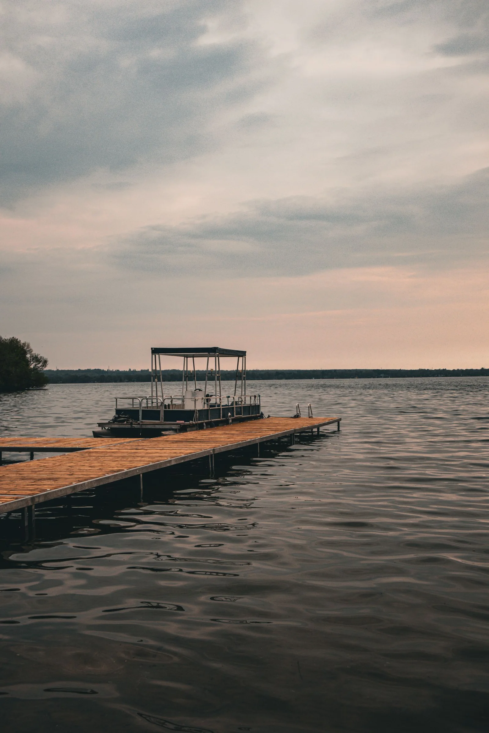 Pier and moored boat on a quiet lake